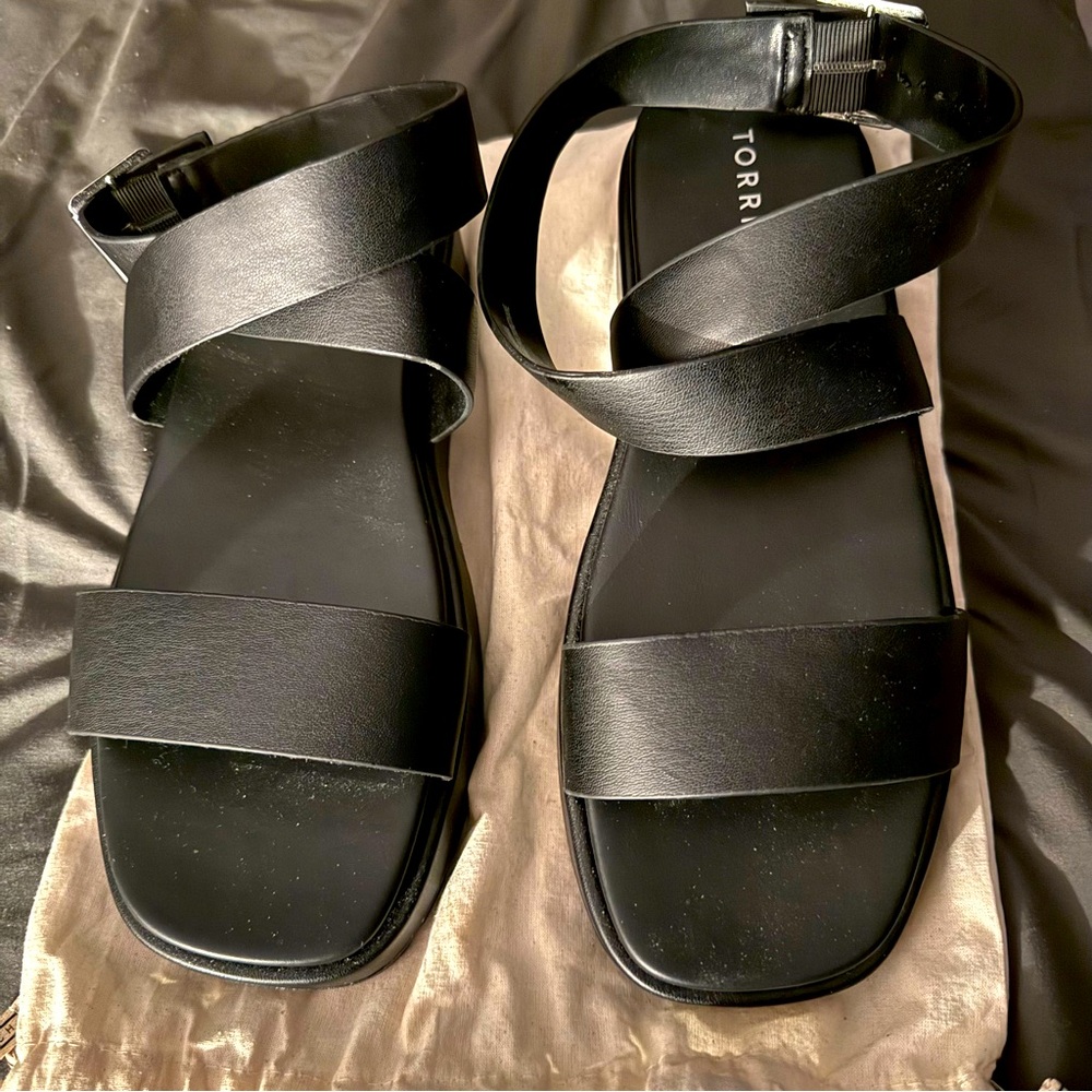 Black wrap around the ankle wedges. Never Worn